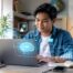 Filipino student using AI tools on a laptop for school research, writing, and online learning.